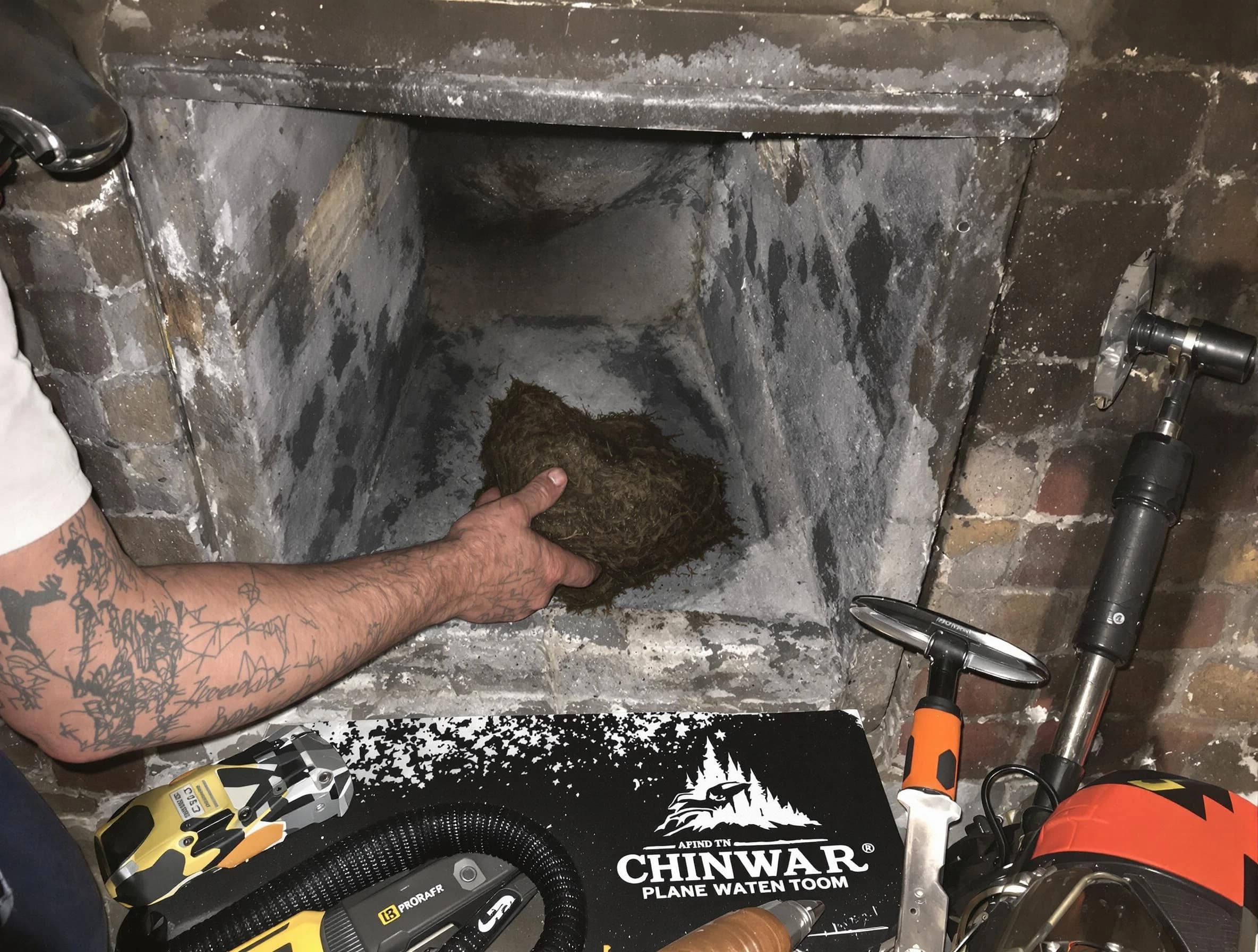 Lilburn Chimney Sweep safely removing debris and screening chimney in Lilburn, GA